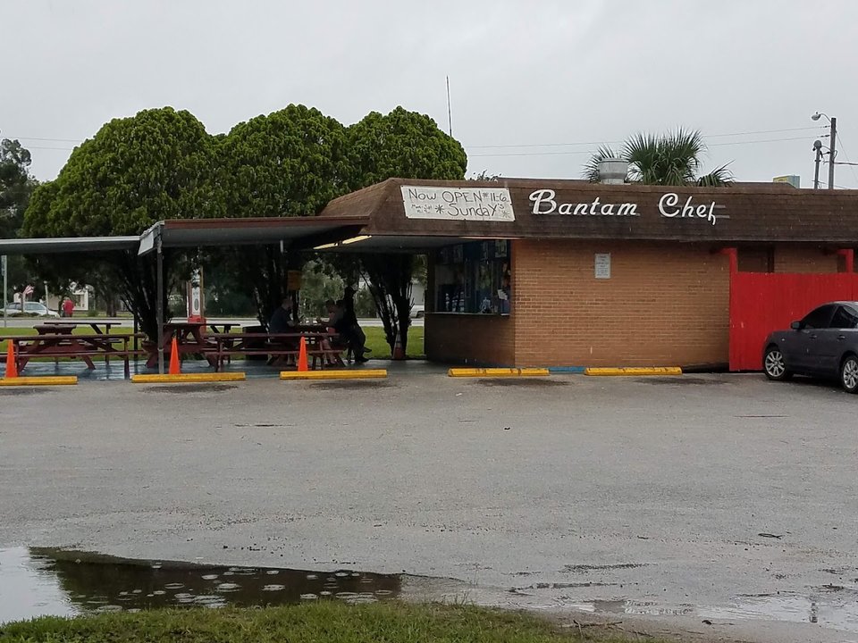 Window-serve seafood restaurant with a plain storefront.